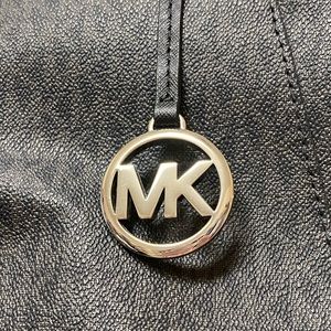 Michael Kors black and gray purse.